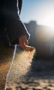 Preview wallpaper hand, sand, sunlight, glare