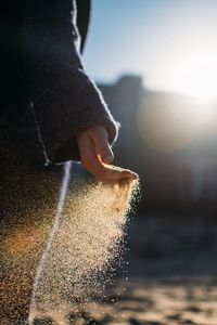 Preview wallpaper hand, sand, sunlight, glare