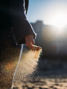 Preview wallpaper hand, sand, sunlight, glare