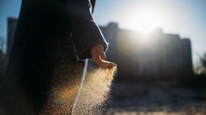 Preview wallpaper hand, sand, sunlight, glare