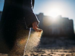 Preview wallpaper hand, sand, sunlight, glare