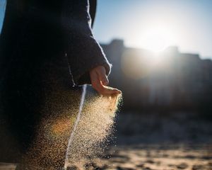 Preview wallpaper hand, sand, sunlight, glare