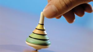 Preview wallpaper hand, spinning top, toy, blue background