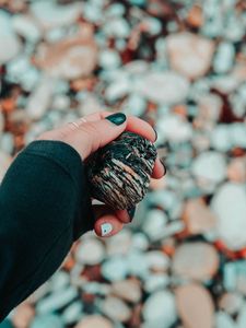 Preview wallpaper hand, stone, sea stones, fingers, manicure