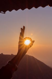 Preview wallpaper hand, sun, rays, sunset, dawn