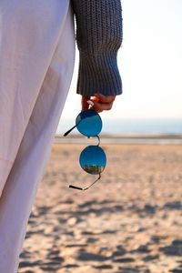 Preview wallpaper hand, sunglasses, style, beach, sand, summer