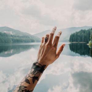 Preview wallpaper hand, tattoos, touch, lake, landscape