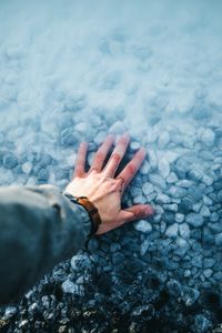 Preview wallpaper hand, water, stones, bottom