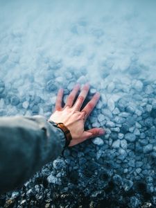 Preview wallpaper hand, water, stones, bottom
