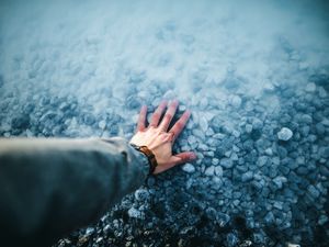 Preview wallpaper hand, water, stones, bottom