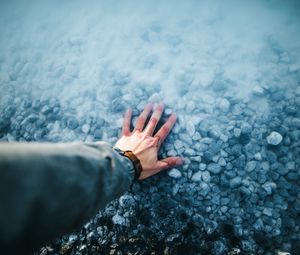 Preview wallpaper hand, water, stones, bottom