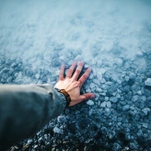 Preview wallpaper hand, water, stones, bottom