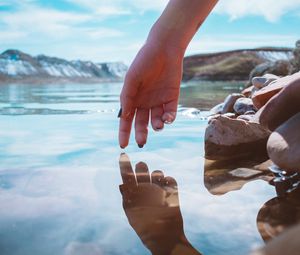 Preview wallpaper hand, water, touch, reflection