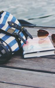 Preview wallpaper handbag, sunglasses, book, river
