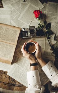 Preview wallpaper hands, cup, book, page, camera, flower