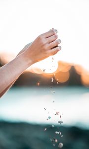 Preview wallpaper hands, pebbles, stones, movement, macro