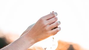 Preview wallpaper hands, pebbles, stones, movement, macro