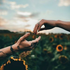 Preview wallpaper hands, touch, tattoos, sunflowers