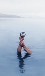 Preview wallpaper hands, water, anchor, immersion, symbolic