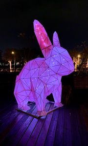 Preview wallpaper hare, figure, statue, light, purple, dark