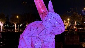 Preview wallpaper hare, figure, statue, light, purple, dark