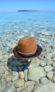 Preview wallpaper hat, water, stones, coast