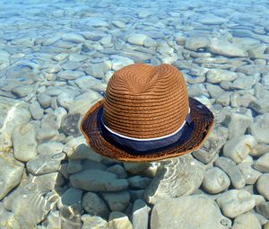 Preview wallpaper hat, water, stones, coast