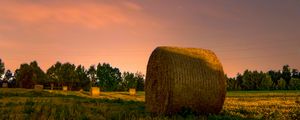 Preview wallpaper hay, stack, field, sunset, grass, sky