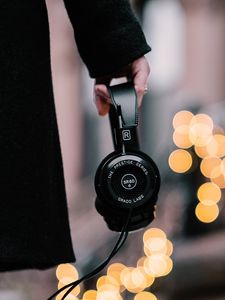 Preview wallpaper headphones, hand, coat, glare