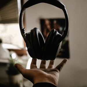 Preview wallpaper headphones, hand, toss, levitation, music