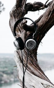 Preview wallpaper headphones, tree, trunk, bark