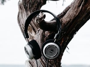 Preview wallpaper headphones, tree, trunk, bark