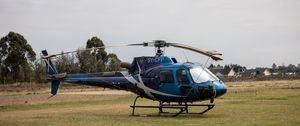 Preview wallpaper helicopter, blue, grass, field