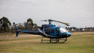 Preview wallpaper helicopter, blue, grass, field