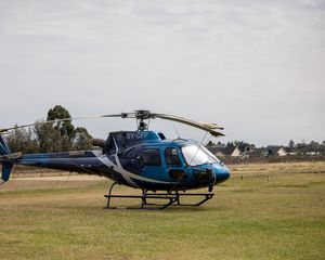 Preview wallpaper helicopter, blue, grass, field