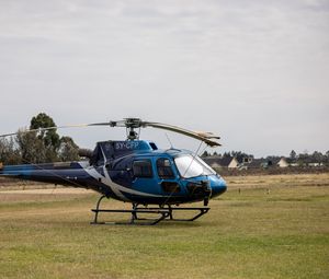 Preview wallpaper helicopter, blue, grass, field