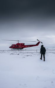 Preview wallpaper helicopter, man, snow, winter