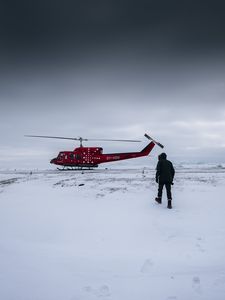 Preview wallpaper helicopter, man, snow, winter