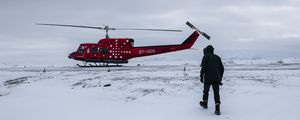 Preview wallpaper helicopter, man, snow, winter