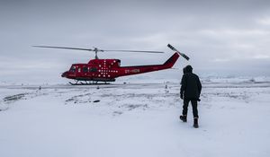 Preview wallpaper helicopter, man, snow, winter