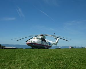 Preview wallpaper helicopter, mi-26, grass, russia, meadow, house, mountain, people
