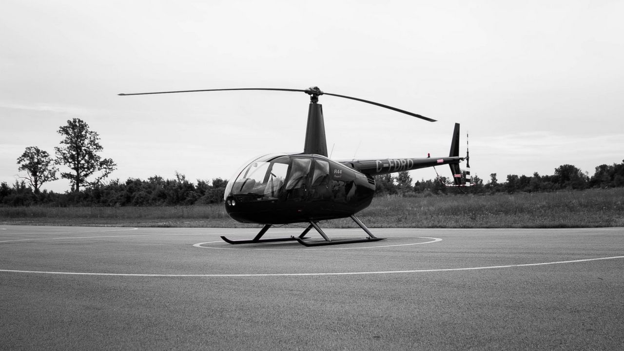 Download wallpaper 1280x720 helicopter, playground, bw, air transport,  blades hd, hdv, 720p hd background