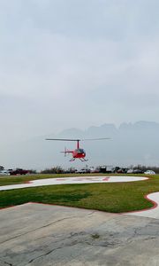 Preview wallpaper helicopter, runway, pad, fog, red