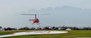 Preview wallpaper helicopter, runway, pad, fog, red