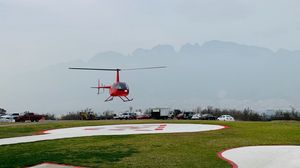 Preview wallpaper helicopter, runway, pad, fog, red