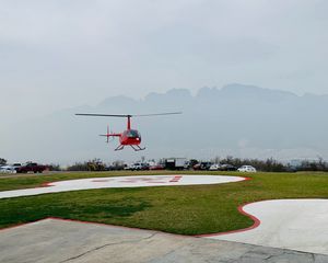 Preview wallpaper helicopter, runway, pad, fog, red