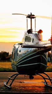 Preview wallpaper helicopter, sunset, airfield