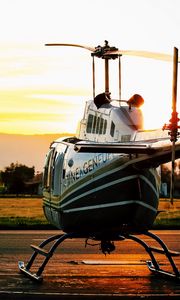 Preview wallpaper helicopter, sunset, airfield