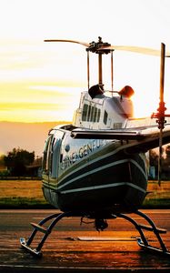 Preview wallpaper helicopter, sunset, airfield