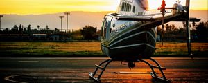 Preview wallpaper helicopter, sunset, airfield